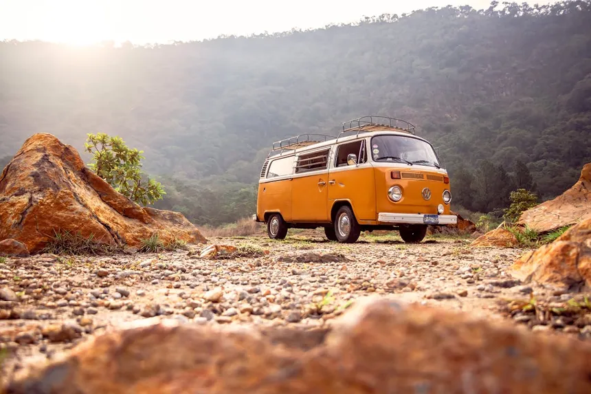 Vintage camper van parked in scenic mountain location showcasing off-grid power needs for RV and camping