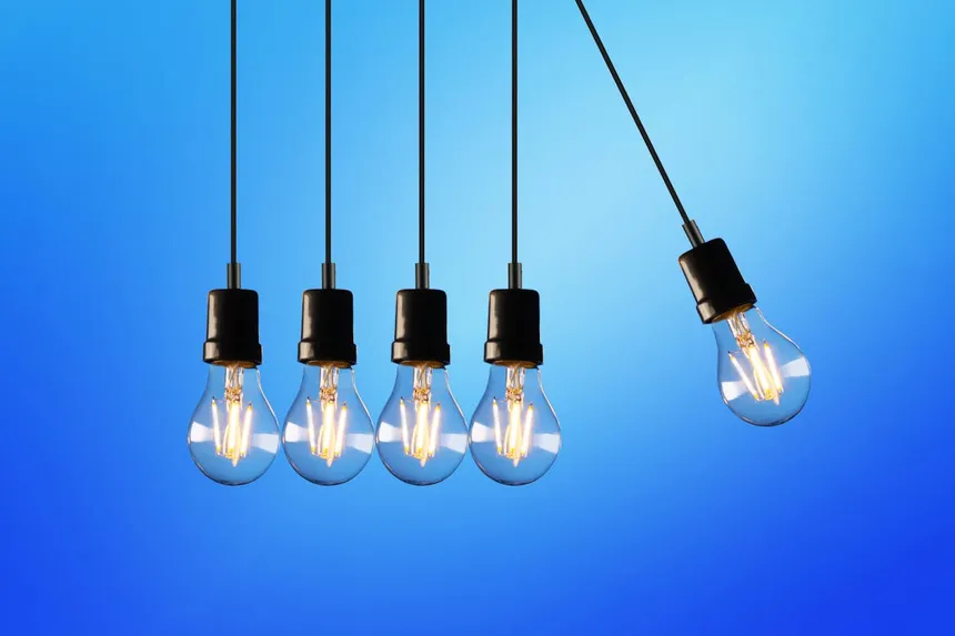 Edison light bulbs illuminated against blue background representing reliable home power backup