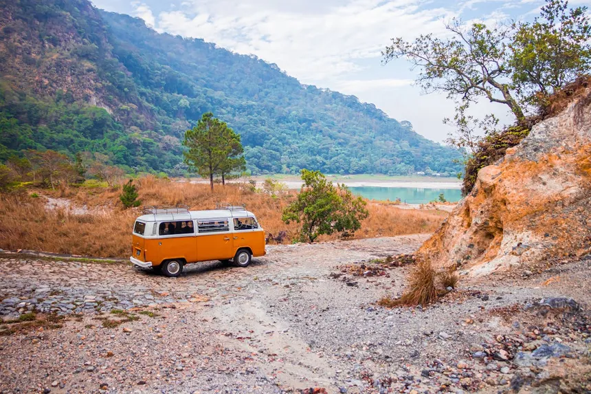 Classic camper van parked in scenic mountain landscape for off-grid RV camping adventure